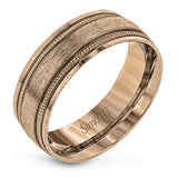 A textured rose gold exterior conceals a classic white gold interior in this elegant, modern wedding band