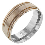 A textured rose gold exterior conceals a classic white gold interior in this elegant, modern wedding band