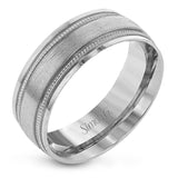 A textured rose gold exterior conceals a classic white gold interior in this elegant, modern wedding band