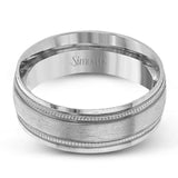 A textured rose gold exterior conceals a classic white gold interior in this elegant, modern wedding band