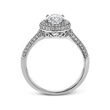 Classic and elegant, this white gold ring sparkles with .40 ctw of round white diamonds framing its oval shaped centerpiece.