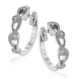 These beautiful white gold earrings feature an intricate scrolling design with .11 ctw of round white diamonds for just a hint of sparkle.