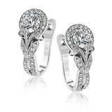 Magnificently glamorous, these white gold earrings feature delicate milgrain edging along with .21 ctw of round white diamond accents.