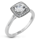 Tasteful yet glamorous, this white gold ring features an eye-catching square halo that glitters with .11 ctw of round white diamonds.