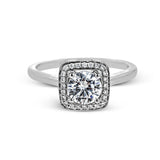 Tasteful yet glamorous, this white gold ring features an eye-catching square halo that glitters with .11 ctw of round white diamonds.