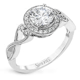 This remarkably beautiful white gold ring features intricate milgrain details alongside a lovely halo of .06 ctw of round white diamonds.