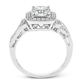 This dazzling, vintage-inspired white gold ring balances organic and geometric shapes with the help of .28 ctw of round white diamond accents.