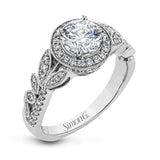 The stunning nature-inspired design of this white gold engagement ring features lovely milgrain edging and a total of .34 ctw of round white diamond accents.