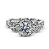 The stunning nature-inspired design of this white gold engagement ring features lovely milgrain edging and a total of .34 ctw of round white diamond accents.