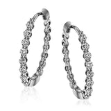 These classic white gold hoops glimmer with .33 ctw of white diamonds