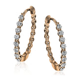 These classic rose gold hoops glimmer with .33 ctw of white diamonds