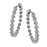 These elegant white gold hoops sparkle with .99 ctw of white diamonds