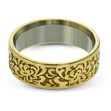 This wedding band's elegant, textured design in yellow gold is accented by a simple white gold interior