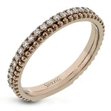 A line of .33 ctw of white diamonds sits alongside a row of granulation in this band that adds the ideal touch of shine. Perfect for stacking with other rings.