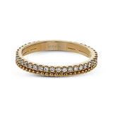 A line of .33 ctw of white diamonds sits alongside a row of granulation in this band that adds the ideal touch of shine. Perfect for stacking with other rings.