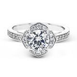 A floral inspired diamond engagement rng 0.35 ctw. has a vintage touch of milgrain beading, and is made to hold a 1.0 ct center