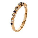 This vintage inspired 18k rose gold ring contains .12 ctw of round white diamonds in a delicate swirling design. Perfect for stacking.