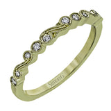 This vintage inspired 18k yellow gold ring contains .12 ctw of round white diamonds in a delicate swirling design. Perfect for stacking.