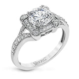 Beautiful and timeless, this white gold ring's intricately detailed design features milgrain edging and .33 ctw of round white diamonds.