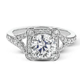 Beautiful and timeless, this white gold ring's intricately detailed design features milgrain edging and .33 ctw of round white diamonds.