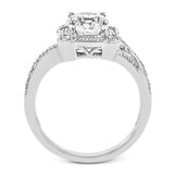 Beautiful and timeless, this white gold ring's intricately detailed design features milgrain edging and .33 ctw of round white diamonds.