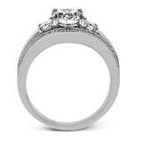 This remarkable white gold ring shows off an oval shaped centerpiece flanked by .47 ctw of trapezoid shaped white diamonds alongside .27 ctw of round white diamonds.