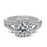 This elegant, contemporary design in white gold sparkles with .45 ctw of round white diamonds in its halo and split shank.