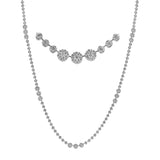 This deceptively delicate white gold necklace is in fact quite substantial, featuring an incredible 9.88 ctw of round white diamonds
