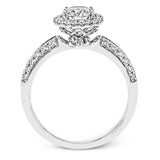 This delicate, vintage-inspired engagement ring sparkles with .42 ctw of round white diamonds in its halo and side details, all set in beautiful white gold.