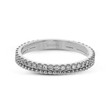 A line of .33 ctw of white diamonds sits alongside a row of granulation in this band that adds the ideal touch of shine. Perfect for stacking with other rings.