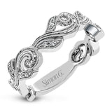 This nature-inspired 18k white gold band is set with the perfect touch of .13 ctw of white diamonds.