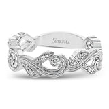 This nature-inspired 18k white gold band is set with the perfect touch of .13 ctw of white diamonds.