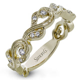 This nature-inspired 18k white gold band is set with the perfect touch of .13 ctw of white diamonds.