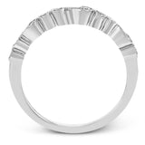 This vintage inspired 18k white gold ring contains .11 ctw of round white diamonds in a delicate swirling design. Perfect for stacking.