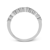 This vintage inspired 18k white gold ring contains .11 ctw of round white diamonds in a delicate swirling design. Perfect for stacking.