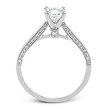 This absolutely stunning white gold engagement ring features a sleek design with .21 ctw of round white diamonds for a touch of glamour.