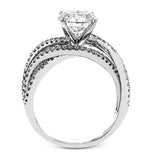 Delicate, overlapping tendrils of white and rose gold sparkle with .52 ctw of round white diamonds for a contemporary, nature-inspired design.