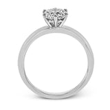 This beautifully simple design in white gold is the perfect setting to let a single round stone shine.
