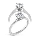 The clean lines of this white gold ring perfectly frame a single round stone as a centerpiece.