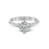 The clean lines of this white gold ring perfectly frame a single round stone as a centerpiece.