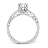 This sleek, elegant white gold ring features delicate filigree detailing to accentuate its single, central stone.