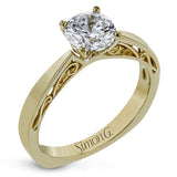 This sleek, elegant white gold ring features delicate filigree detailing to accentuate its single, central stone.