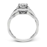 The flowing, organic lines of this contemporary, nature-inspired white gold ring provide a beautifully understated setting for a single, central stone.