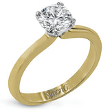 This sleek, unadorned white gold ring provides an elegantly modern setting for a single, central stone.
