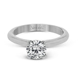 This sleek, unadorned white gold ring provides an elegantly modern setting for a single, central stone.