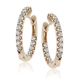 These elegant white gold earrings feature 1.95 ctw of white diamonds