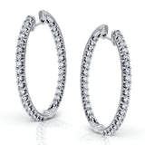 These classic white gold earrings sparkle with an impressive 1.96 ctw of white diamonds