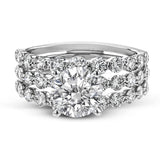 This 18k white gold engagement set certainly makes a statement with 1.72 ctw of white diamonds set in three rows.