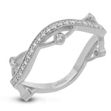 This 18k white gold band has a design of in intertwined lines of pave set and bezel set diamonds, which creates a distinctive look.