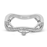 This 18k white gold band has a design of in intertwined lines of pave set and bezel set diamonds, which creates a distinctive look.